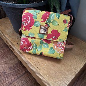 Yellow Flower pattern Dooney and Bourke leather purse with leather strap